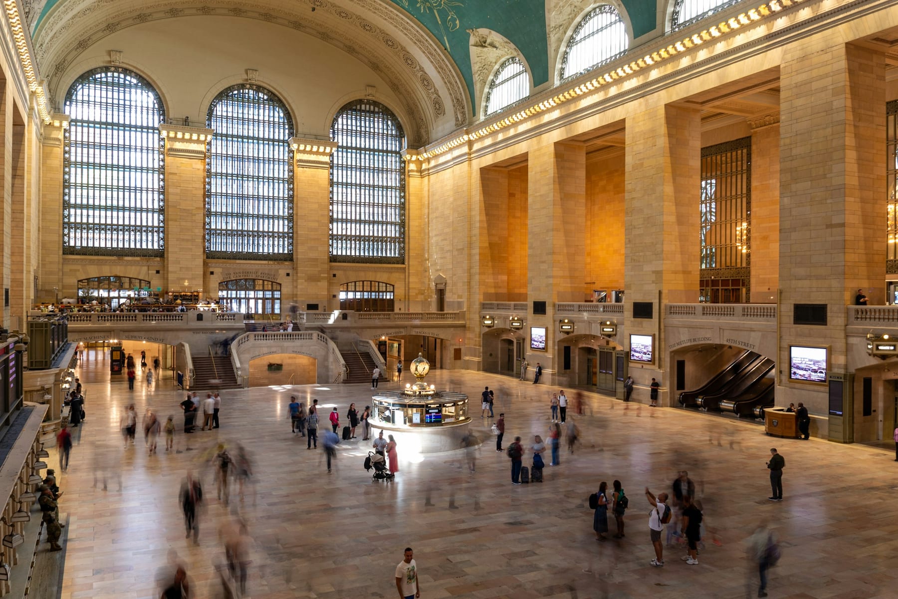 Grand Central Terminal main concourse — light through arched windows over the marble floor