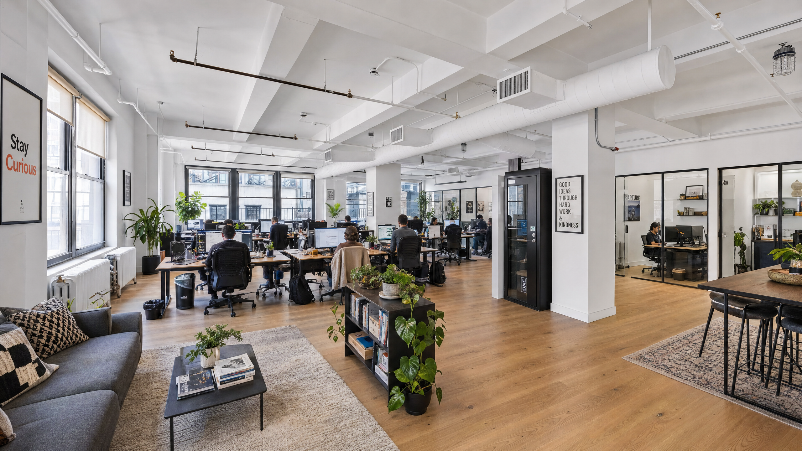 Open boutique floor at 39 W 37 — tenanted, daylight from multiple sides
